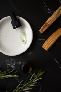 drops of aromatic oil in pipette prepared for spa treatment